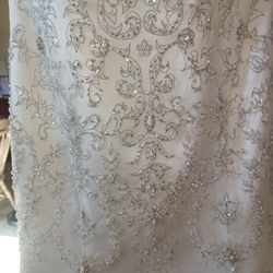 Oleg Cassini White bead embroidered wedding dress Size 10 Ivory mermaid style with a sweetheart neckline

Condition is used with a couple small tears 