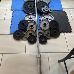 285lbs of Olympic weights with 7ft bar with clamps
