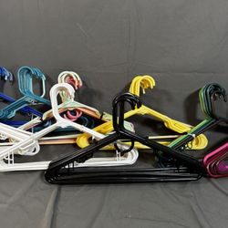 Lots of plastic hangers, assorted colors