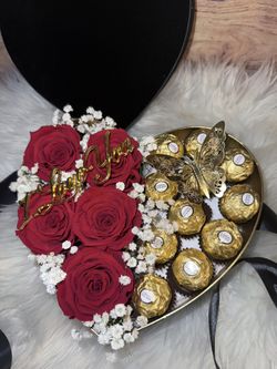 Beautiful velvet heart box arrangement with chocolates and roses.