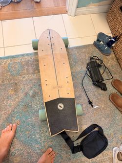 Evolve skateboard stoke with charger