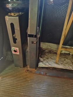 Wheel chair lift for a bus