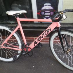 Aventon Cordoba coral color city bike ; free wheel gear ; 6061 aluminum; 52 cm tall ; 53 long ; continental gaterskin ; size of the tires 700c ; 87842