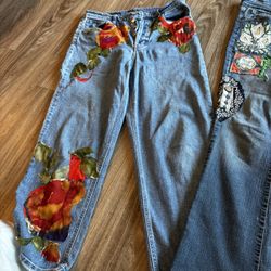 2 Pairs Of Patched Jeans 