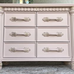 newly refinished pink and gold solid wood dresser