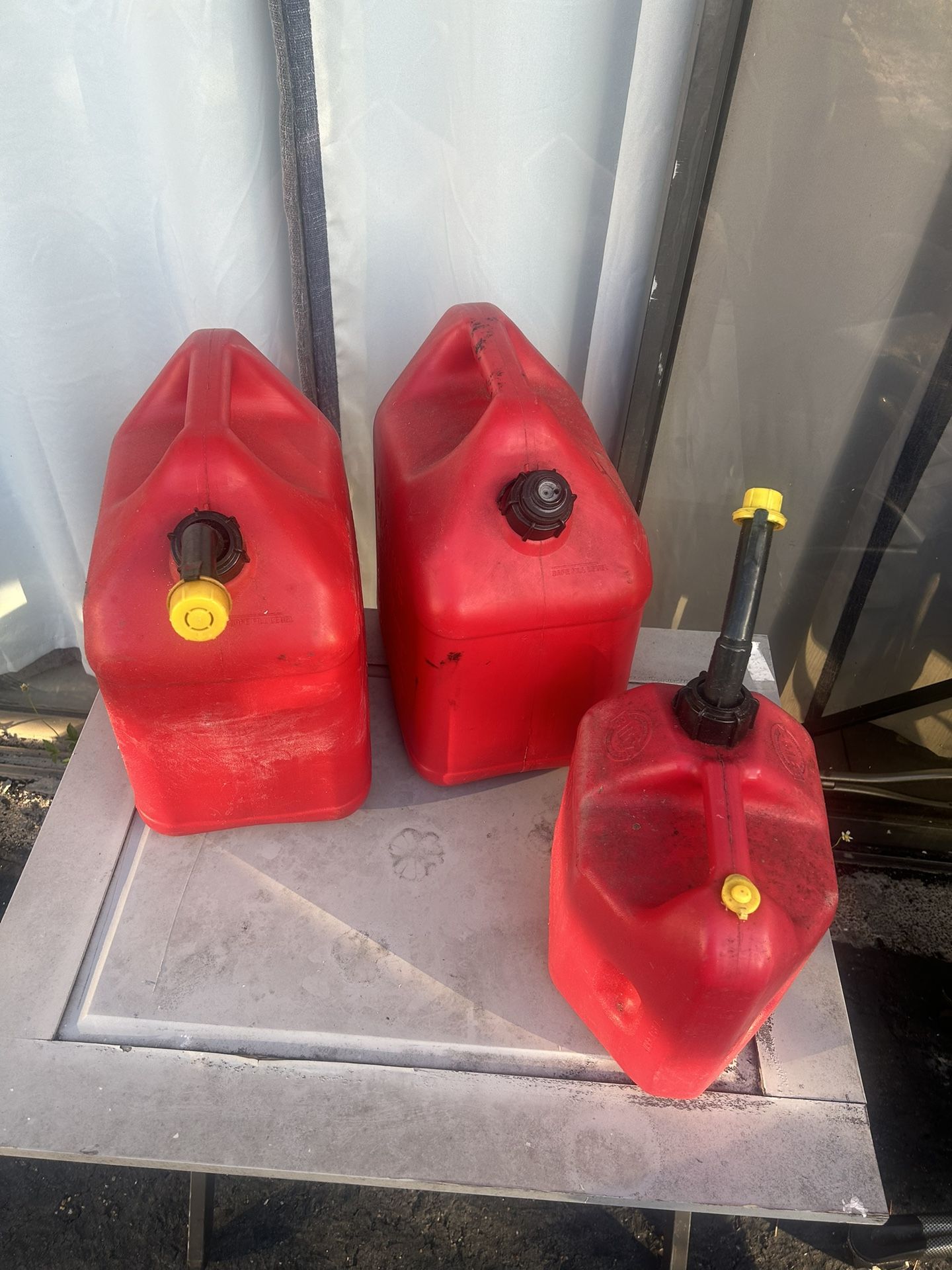 2 - 5 Gallon And 1 - 2.5 Gallon Gas Cans