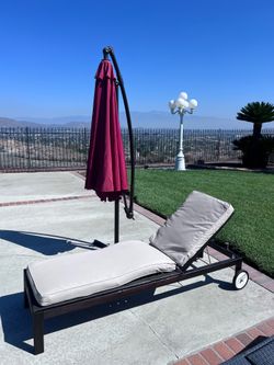 Chaise lounge and umbrella