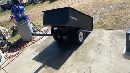 Riding mower dump trailer