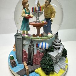  snow globe featuring two figures lighting a menorah,USA Landmarks 