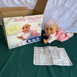 vintage Russ Troll Baby Giggles Battery Operated Troll by Russ 1990s, in original box. Not tested. So selling cheaper than normal VERY CLEAN AND IN