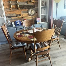 Country style wooden dining table with 4 chairs.