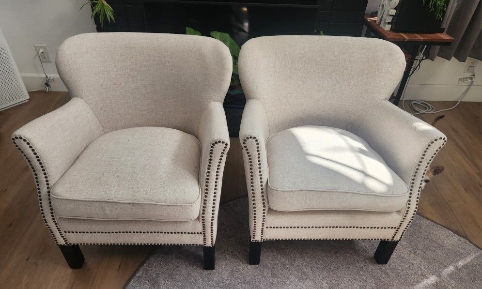 2 White Cushioned Chairs