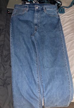 Levis 90’s style loose fitting blue and dark jeans