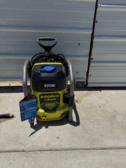 2000 psi Ryobi electric pressure washer includes hose, gun, water tips