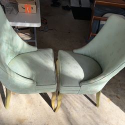 Two green upholstered chairs