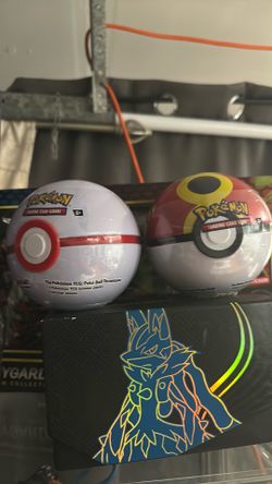 2 pokeball tin with 3 packs each pokemon Tcg