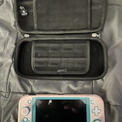 SWITCH LITE  TEAL ( Great Condition, Pink Skin Covers)