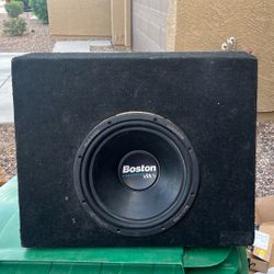 Boston Acoustics Generator car subwoofer in carpeted enclosure. Speaker and surround are in good condition. Terminal cup on back. Normal cosmetic wear