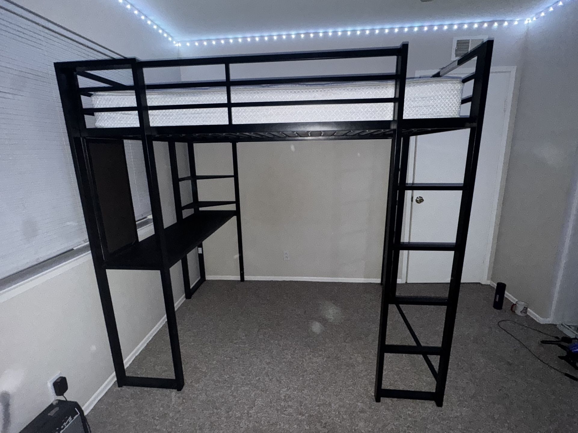 black bunk bed with desk