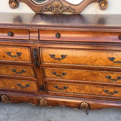 solid wood dresser with a mirror. 