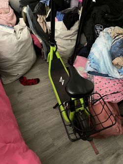 Green Electric Scooter with Seat and Basket