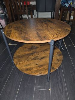 2-tier round coffee table featuring built-in multi power adapter
