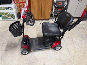Electric four wheel scooter