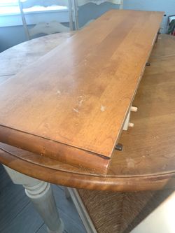 Wood dining table with extension and four chairs