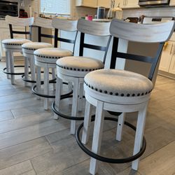 A set of (5) counter stools