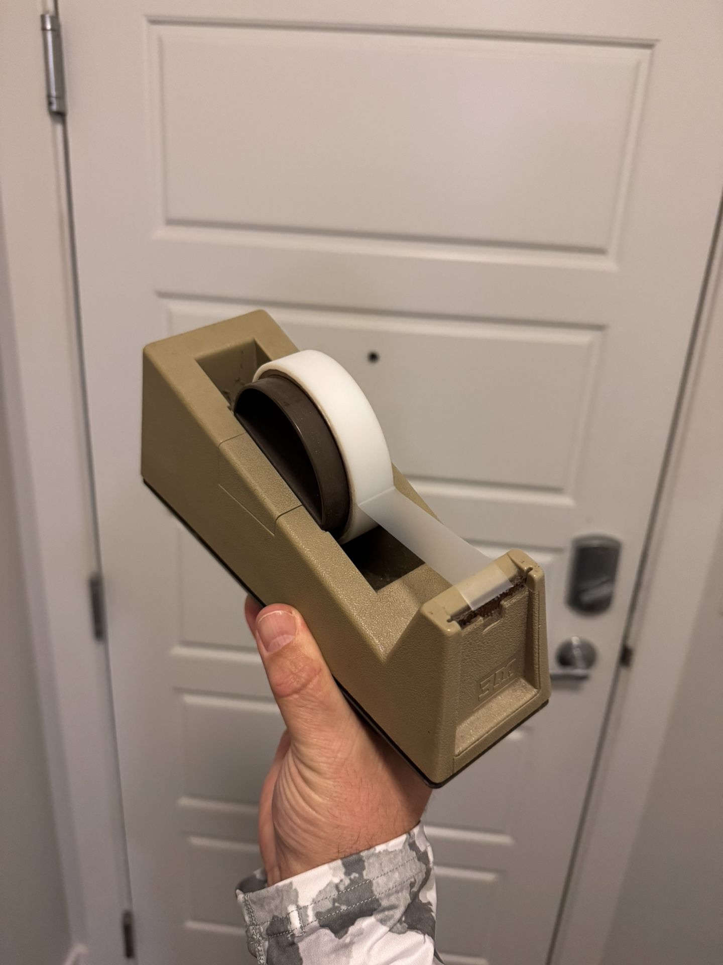 Tape Dispenser With Replacement Roll