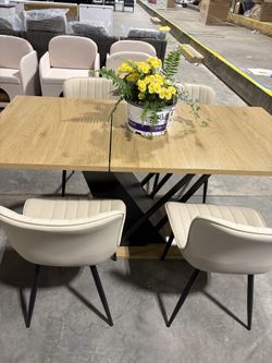 【Set Of 5】With a 61.81 (46.46) inch Extendable Tabletop, This Modern Geometric Dining Table Comes with a Metal Frame,With 4 Chairs  $399  Warehouse Ad