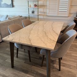 Havertys rectangular marble topped dining table with 4 upholstered chairs