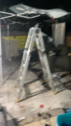 Ladder open extends straight and slides up and down or folds in half