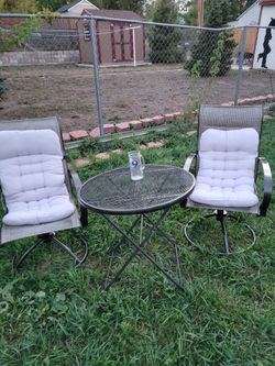 Wrought Iron Table and swivel Rocking Chair's