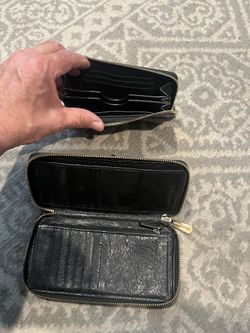 Two leather Michael Kors wallets-used