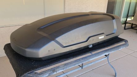 Thule Force XT L rooftop cargo box with mounting hardware, locks and keys.