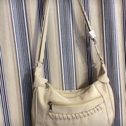Purse, NEVER USED, cardboard still on strap, lightweight, material is microfiber, 11 1/2 inches wide by about 9 inches deep, front pocket, 1 zippered