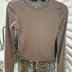 2 Women’s Long Sleeve Tops, beige / Light Brown -colored ,  made from a silky knit fabric.
