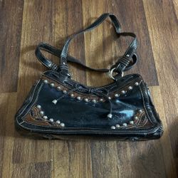 Women’s handbag brown and  gold embroidered studded trim.Front bow tie