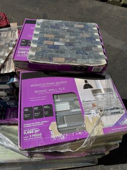 Pallet of building supplies backsplash and flooring
