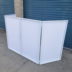 White Facade With Carry On Bag
