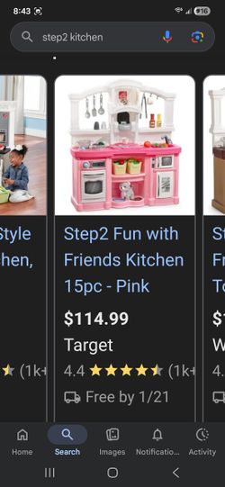 Toy Kitcheb With Lots Of Fake Food And Pots And Pans