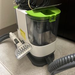  a Mujerbay Upholstery Carpet Cleaner, also known as a portable spot and stain cleaner. This machine is designed for localized cleaning of stains on i