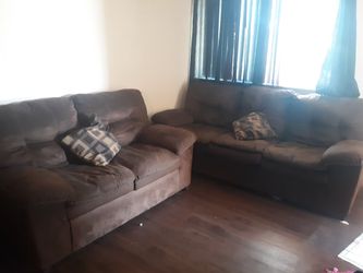 Brown couches fair condition