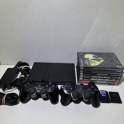 PS2 Slim SCPH-75001 Bundle 2 Controllers 7 Games