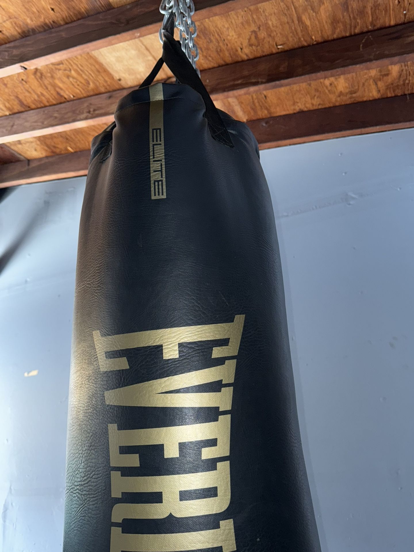weights with bars and punching bag.