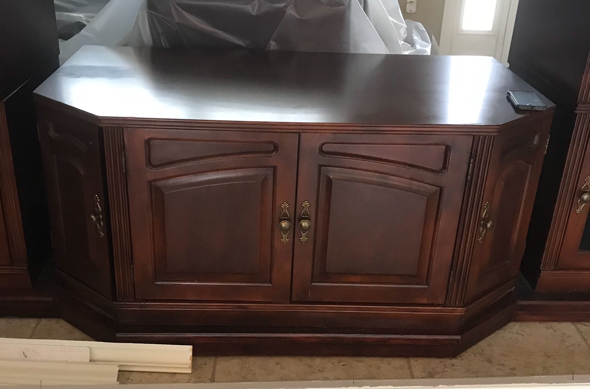 Cherry wood brown wall console- center piece only. Tv console with a lot of storage. $90