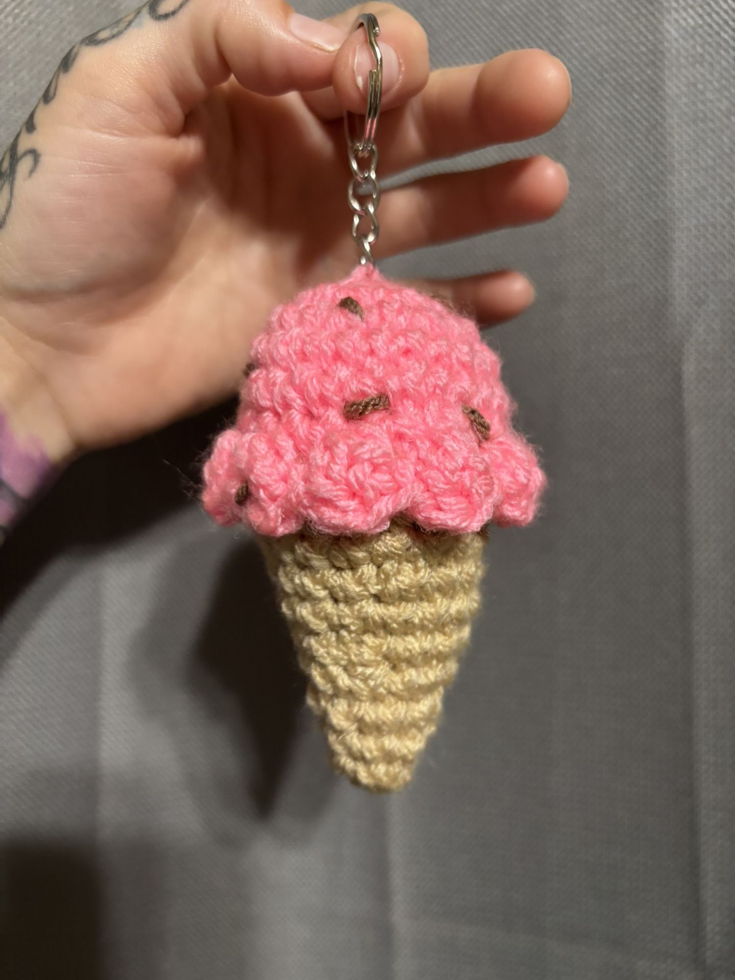 Handmade Little crochet pink strawberry ice cream cone keychain with chocolate brown sprinkles! π©· π€