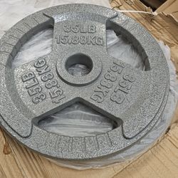 two 35 pound Olympic plates new