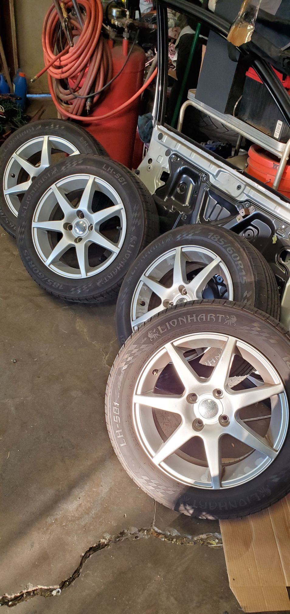 Scion xb wheels 4x100 185/60/15 some curb rash on 2 rims 2 tires are worn other 2 are good